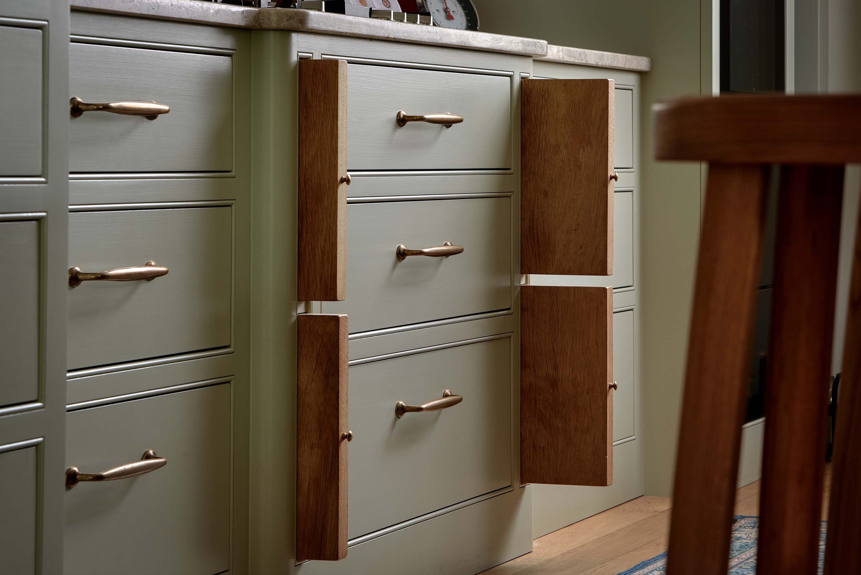 Drawers in a traditional shaker kitchen with pull out solid oak chopping boards